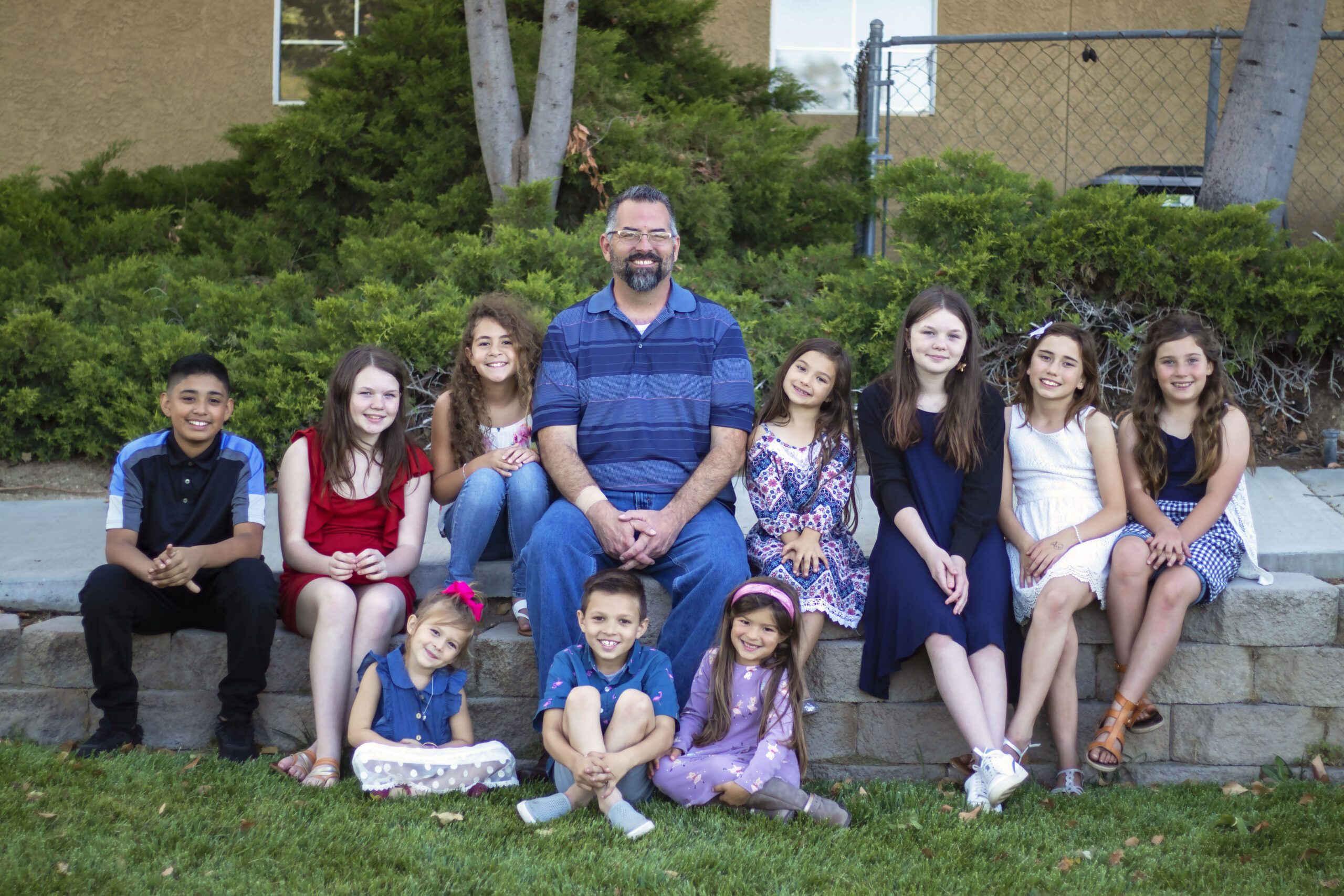 Nick Pardue sitting with school aged kids